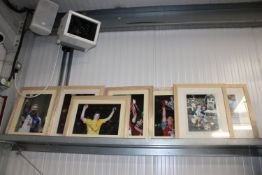 A collection of various framed photographs of foot