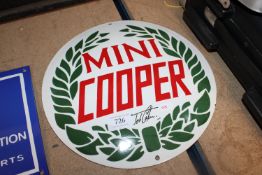 A reproduction Mini Cooper advertising sign