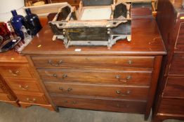 An oak chest fitted four long drawers