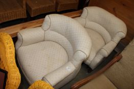 A pair of floral upholstered tub chairs