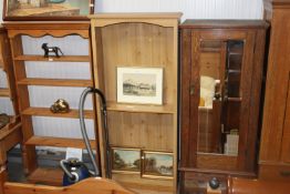 A pine open fronted bookcase with adjustable shelv