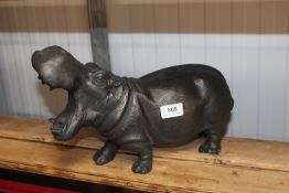 A reproduction ornament in the form of a hippo (59