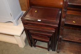 A nest of four mahogany tables