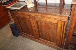 An oak dresser base fitted two doors