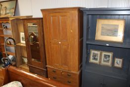 A scumble pine single door wardrobe fitted two short over one long drawer