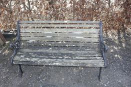 A wooden and cast iron garden bench