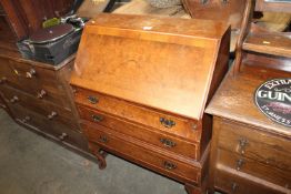 A Burton reproduction bureau fitted three drawers