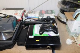 An X-Box 360 together with various accessories