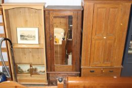 An oak mirrored door wardrobe