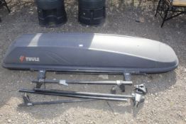 A Thule roof box and roof rack