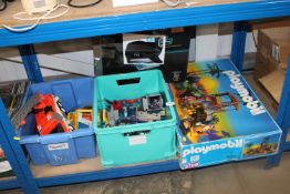 Three boxes containing various children's toys tog