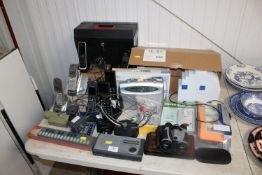 A collection of various phones; a Sony radio; a pa