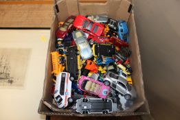 A box containing various die cast vehicles