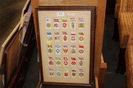 A quantity of framed cigarette cards