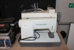 A Singer sewing machine in fitted case, sold as a