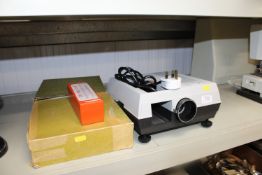 A Hanimex projector together with various slides