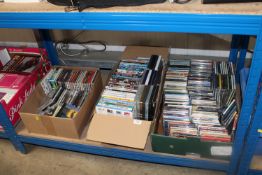 Three boxes containing various CDs and DVDs