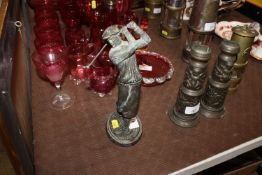 A bronze model of a golfer