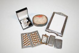 A silver mounted photo frame; three cheese markers