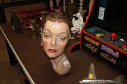 A painted plaster bust in the form of an Art Deco