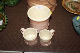 A Philip Wood Pottery brush pot with two smaller mu