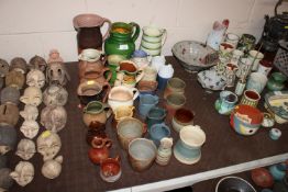 A collection of mostly Studio Pottery jugs and mug