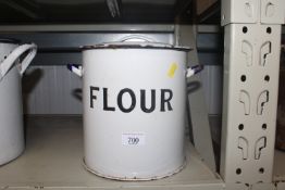 An enamel flour pot and cover