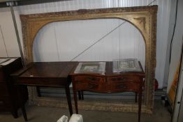 An ornate gilt picture frame approx. 202cms wide x
