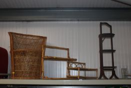A wicker armchair; two wicker and bamboo shelves a