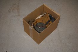 A 1939 dated gas mask within canvas bag with a tin