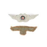 A Luftwaffe visor cap badge with a cloth eagle