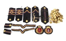 A box of various Merchant Navy insignia and button