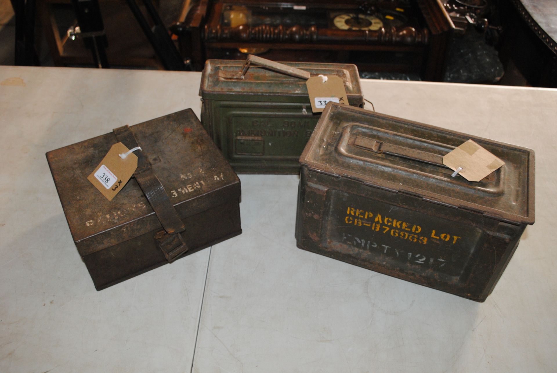 Two ammunition cans with an unknown tin