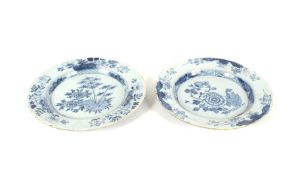 An 18th Century Delft plate, probably Liverpool with floral decoration, 23.5cm dia. and another