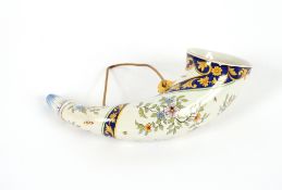 A Faience ware horn, with floral spray decoration, 27cm