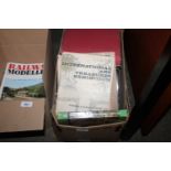 A box containing various books