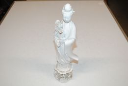 A Chinese blanc de chine figure of He Xiangu, 37cm