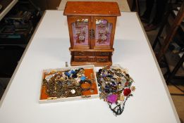 A box containing a jewellery cabinet and various c