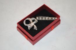 Two sterling silver filigree brooches