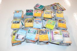 A box containing a large collection of Pokémon car