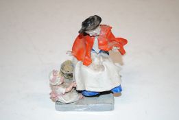 A porcelain figurine marked to base 'Old Dutch Biscuits Prize of London by I. E. Reading 1926'