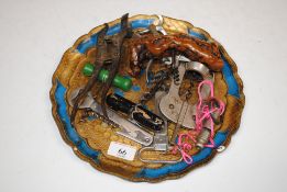 A wooden tray containing Magic Lever corkscrew, va