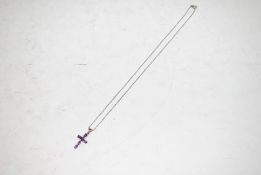 A sterling silver and amethyst cross necklace