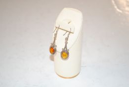 A pair of 925 silver and amber drop earrings