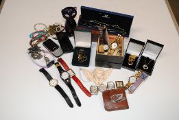 A box containing various costume jewellery and wri