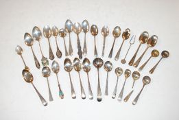 A box of various silver and sterling silver spoons