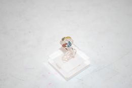 A sterling silver and coloured diamond ring, size