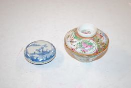 An Oriental blue and white circular pot and cover