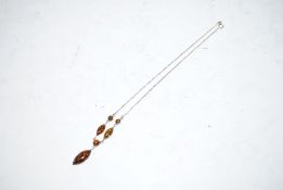 A sterling silver and amber wide drop necklace