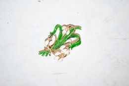 An enamelled snowdrop brooch